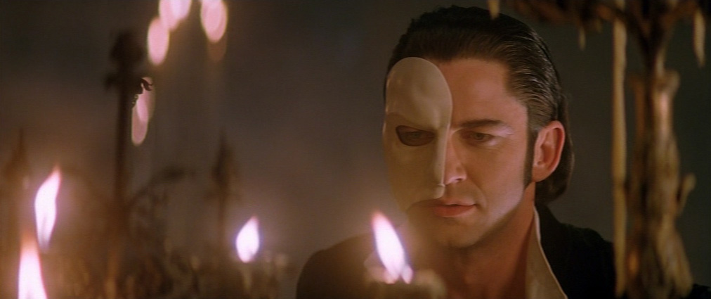 The Phantom of the Opera (2004). Cinematography by John Mathieson. Starring Emmy Rossum. Gerard Butler in The Phantom of the Opera
