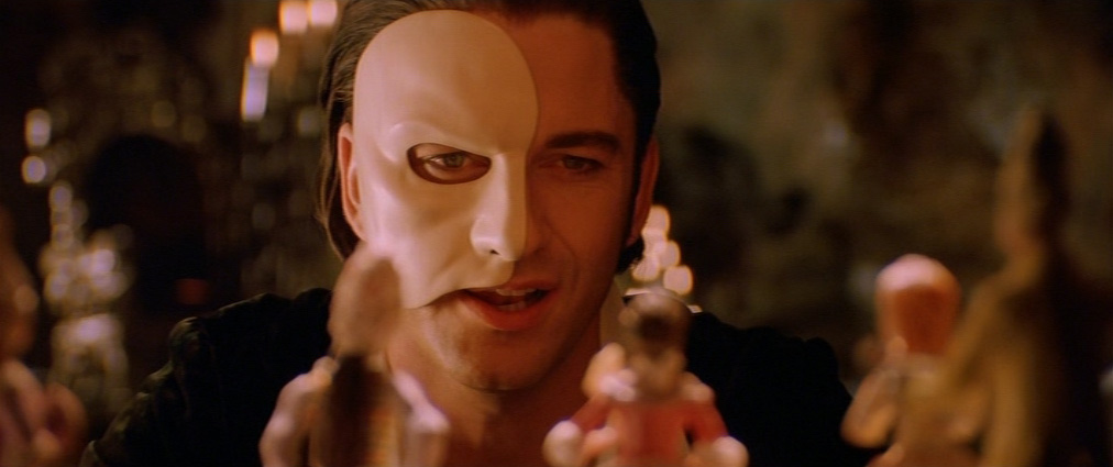 The Phantom of the Opera (2004). Cinematography by John Mathieson. Starring Emmy Rossum. Gerard Butler in The Phantom of the Opera
